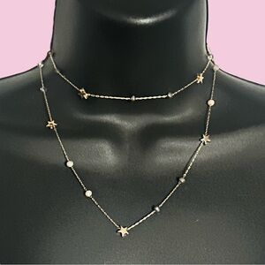 Frenzy long gold tone station stars and crystals necklace